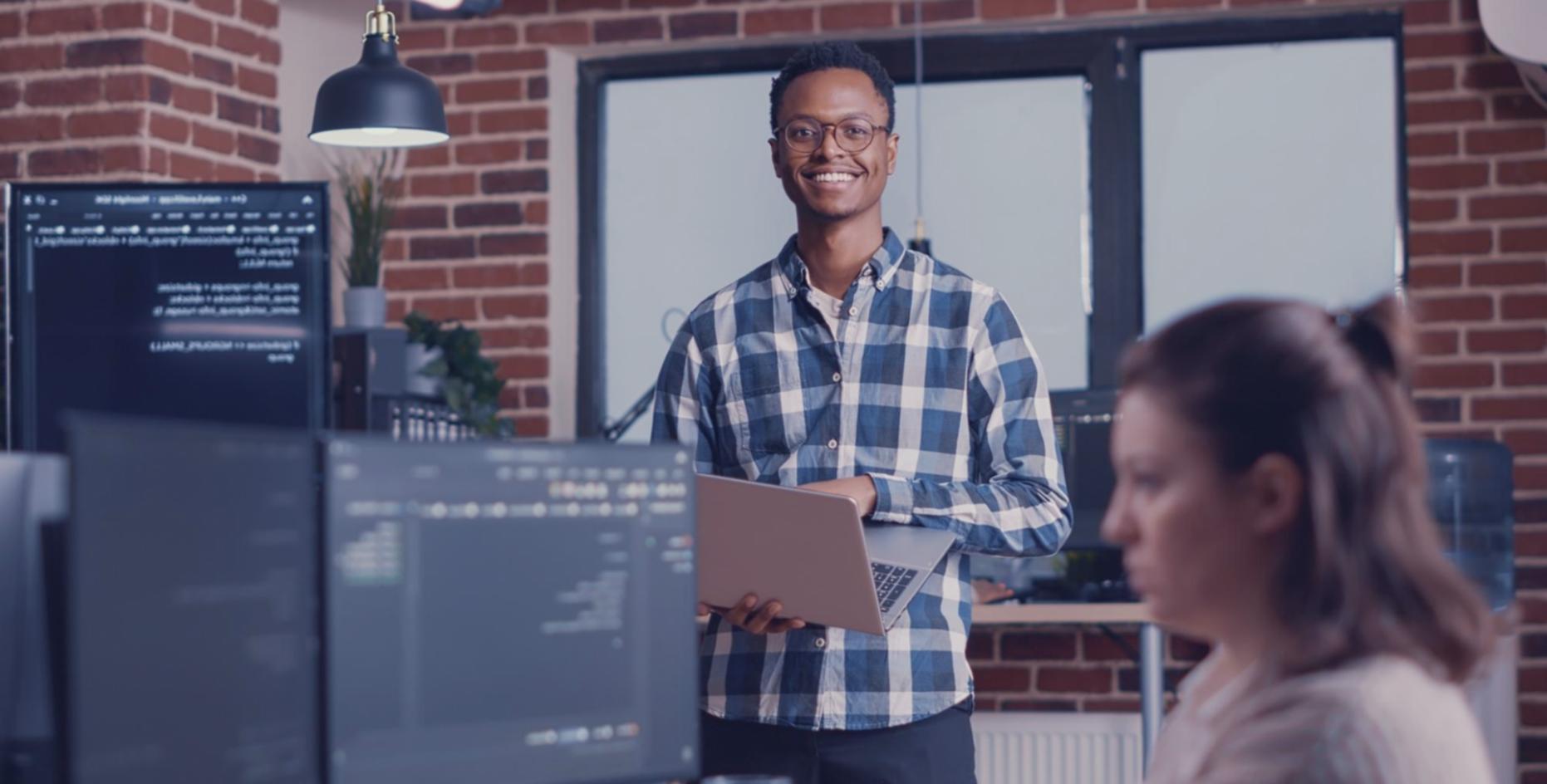 Technical team analyzing mobile app code and performance bottlenecks on multiple screens